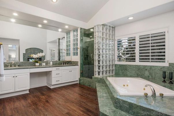 Bathroom, Dual Sink Vanities, Glass Shower, Interior, Recessed Lighting, Wood Texture Flooring