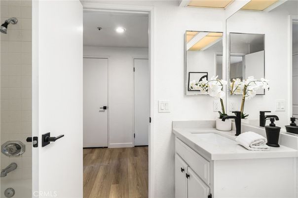 Bathroom, Dual Sink Vanities, Interior, Recessed Lighting, Wood Texture Flooring