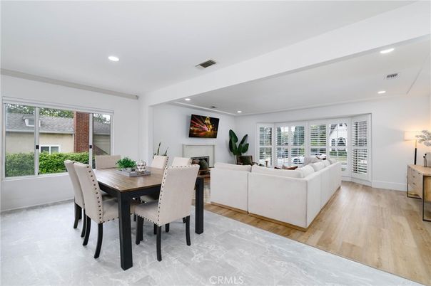 Dining room, Fireplace, Interior, Living room, Recessed Lighting, Wood Texture Flooring