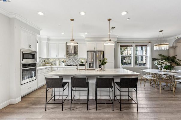 Dining room, Interior, Kitchen, Pendant Lights, Recessed Lighting, Stainless Steel Appliances, Wood Texture Flooring