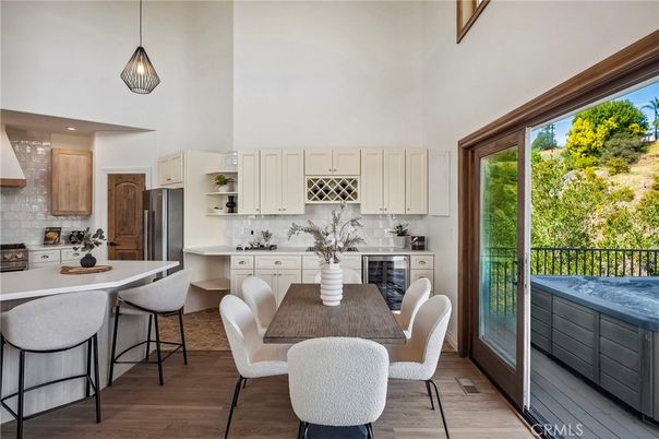 Dining room, Interior, Kitchen, Pendant Lights, Recessed Lighting, Stainless Steel Appliances, Wood Texture Flooring
