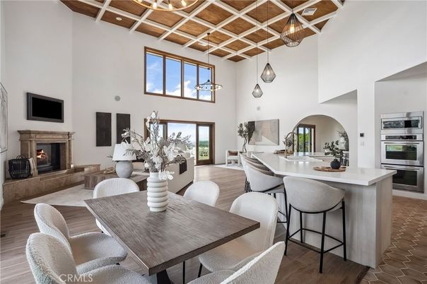 Dining room, Fireplace, Interior, Kitchen, Pendant Lights, Stainless Steel Appliances, Wooden Beams, Wood Texture Flooring
