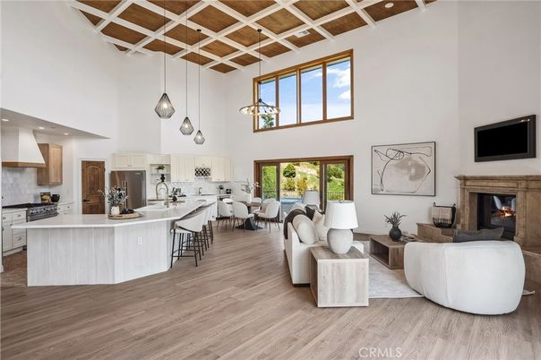 Dining room, Fireplace, Interior, Kitchen, Living room, Pendant Lights, Recessed Lighting, Stainless Steel Appliances, Wood Texture Flooring