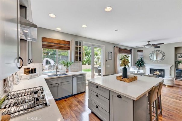 Fireplace, Interior, Kitchen, Recessed Lighting, Stainless Steel Appliances, Wood Texture Flooring
