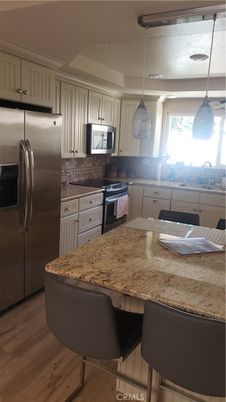 Interior, Kitchen, Pendant Lights, Stainless Steel Appliances, Wood Texture Flooring