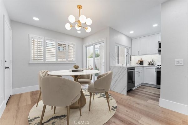 Dining room, Interior, Kitchen, Pendant Lights, Recessed Lighting, Stainless Steel Appliances, Wood Texture Flooring