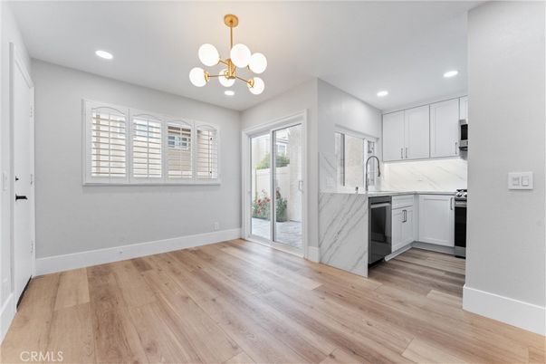 Interior, Kitchen, Marble Walls, Pendant Lights, Recessed Lighting, Stainless Steel Appliances, Wood Texture Flooring