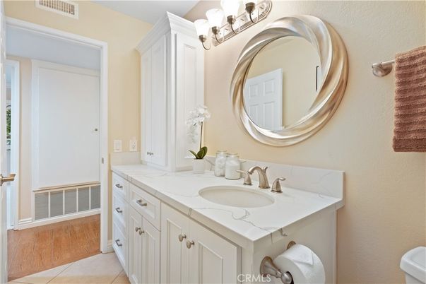 Bathroom, Dual Sink Vanities, Interior, Tile Countertops, Wood Texture Flooring