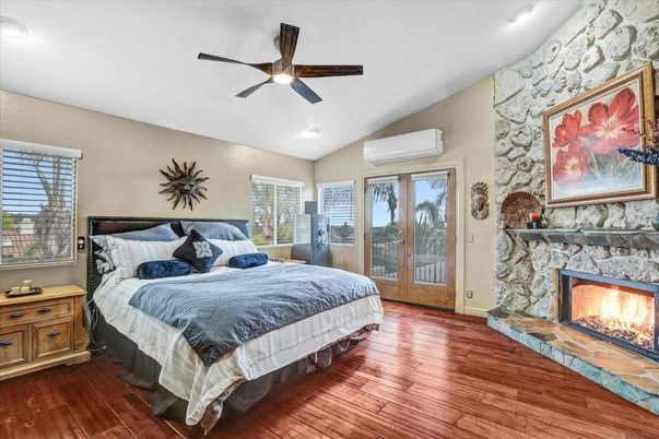 Bedroom, Fireplace, Interior, Recessed Lighting, Stone Walls, Wood Texture Flooring