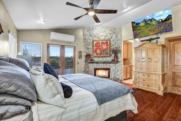 Bedroom, Fireplace, Interior, Recessed Lighting, Stone Walls, Wood Texture Flooring