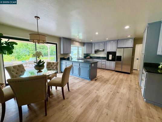 Dining room, Interior, Kitchen, Pendant Lights, Recessed Lighting, Stainless Steel Appliances, Wood Texture Flooring