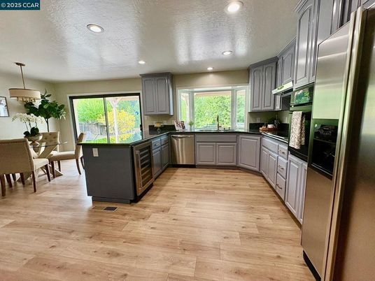 Dining room, Interior, Kitchen, Pendant Lights, Recessed Lighting, Stainless Steel Appliances, Wood Texture Flooring