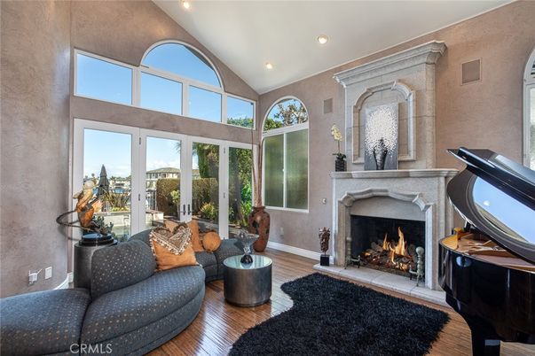 Fireplace, Interior, Living room, Piano, Recessed Lighting, Wood Texture Flooring