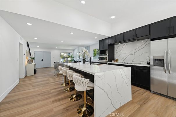 Interior, Kitchen, Marble Walls, Recessed Lighting, Stainless Steel Appliances, Wood Texture Flooring