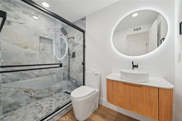 Bathroom, Glass Shower, Interior, Marble Walls, Recessed Lighting, Wood Texture Flooring