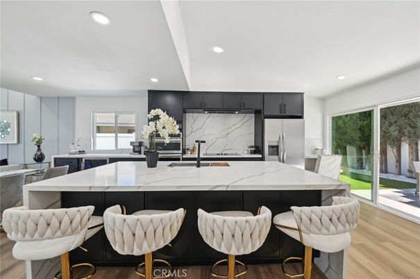 Interior, Kitchen, Marble Walls, Recessed Lighting, Stainless Steel Appliances, Wood Texture Flooring