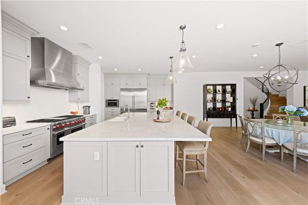 Chandelier, Dining room, Interior, Kitchen, Pendant Lights, Recessed Lighting, Stainless Steel Appliances, Wood Texture Flooring