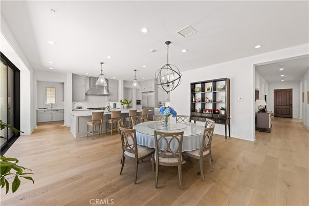 Chandelier, Dining room, Interior, Kitchen, Pendant Lights, Recessed Lighting, Stainless Steel Appliances, Wood Texture Flooring
