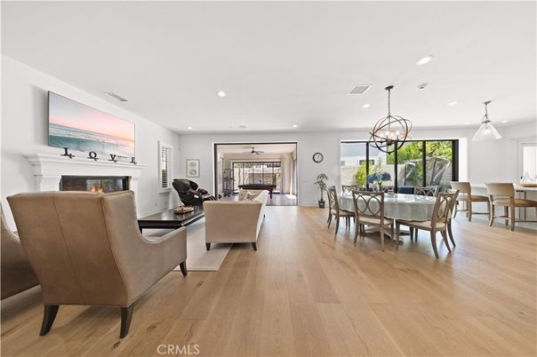 Dining room, Fireplace, Interior, Living room, Pendant Lights, Recessed Lighting, Wood Texture Flooring