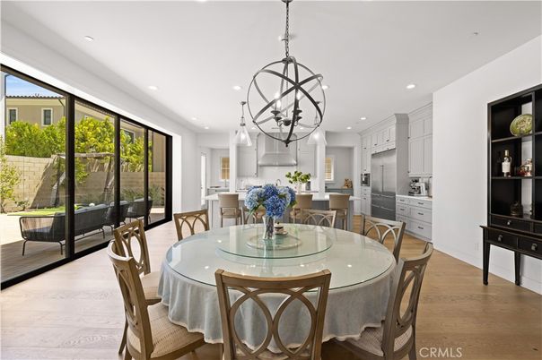Chandelier, Dining room, Interior, Kitchen, Pendant Lights, Recessed Lighting, Stainless Steel Appliances, Wood Texture Flooring