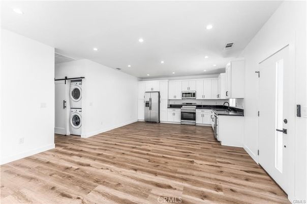 Interior, Kitchen, Recessed Lighting, Stainless Steel Appliances, Washer, Wood Texture Flooring