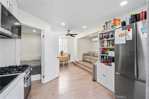 Dining room, Interior, Kitchen, Recessed Lighting, Stainless Steel Appliances, Wood Texture Flooring