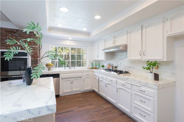 Interior, Kitchen, Recessed Lighting, Stainless Steel Appliances, Stone Walls, Wood Texture Flooring