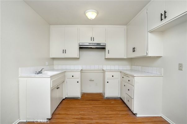 Interior, Kitchen, Tile Countertops, Wood Texture Flooring