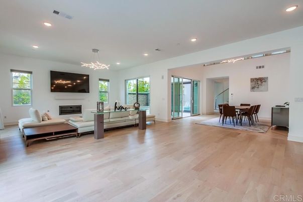 Dining room, Fireplace, Interior, Living room, Pendant Lights, Recessed Lighting, Wood Texture Flooring