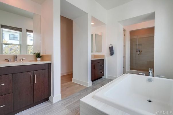Bathroom, Dual Sink Vanities, Glass Shower, Interior, Recessed Lighting, Wood Texture Flooring