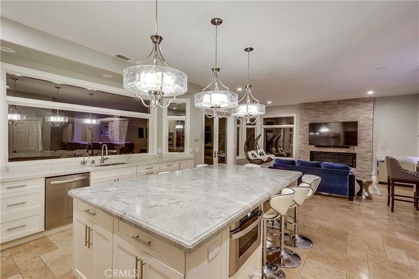 Dining room, Fireplace, Interior, Kitchen, Living room, Pendant Lights, Recessed Lighting, Stainless Steel Appliances, Stone Walls