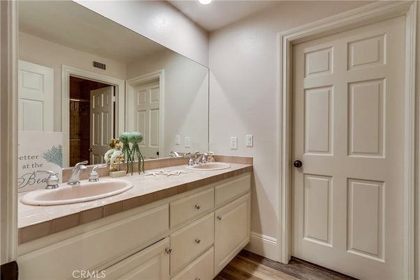 Bathroom, Dual Sink Vanities, Interior, Recessed Lighting, Tile Countertops, Wood Texture Flooring