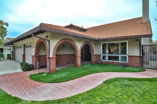 Attached, Backyard, Exterior, Facade, Brick Facade, Mediterranean
