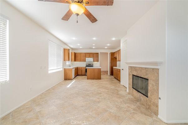 Empty room, Fireplace, Interior, Kitchen, Recessed Lighting, Stainless Steel Appliances
