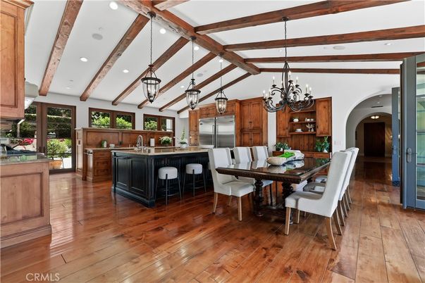 Chandelier, Dining room, Interior, Kitchen, Pendant Lights, Recessed Lighting, Stainless Steel Appliances, Wooden Beams, Wood Texture Flooring