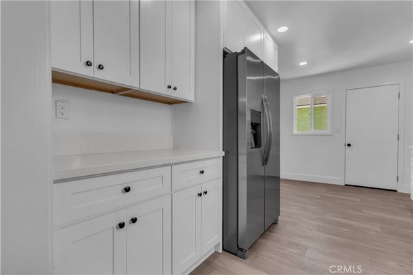 Interior, Kitchen, Recessed Lighting, Washer, Wood Texture Flooring
