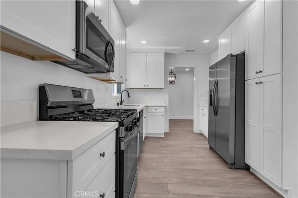 Interior, Kitchen, Recessed Lighting, Stainless Steel Appliances, Wood Texture Flooring