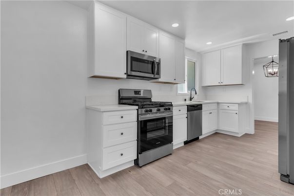 Interior, Kitchen, Pendant Lights, Recessed Lighting, Stainless Steel Appliances, Wood Texture Flooring