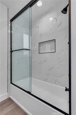 Bathroom, Glass Shower, Interior, Marble Walls, Recessed Lighting, Wood Texture Flooring