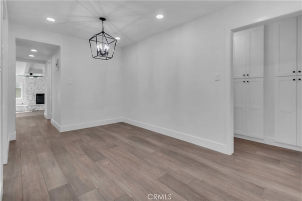 Empty room, Fireplace, Interior, Pendant Lights, Recessed Lighting, Wood Texture Flooring
