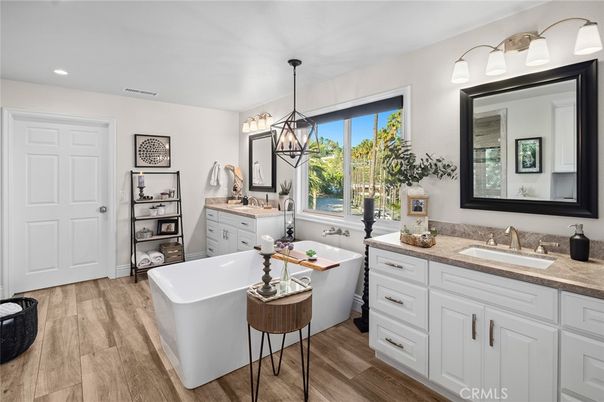 Bathroom, Dual Sink Vanities, Free Standing Baths, Interior, Pendant Lights, Recessed Lighting, Wood Texture Flooring