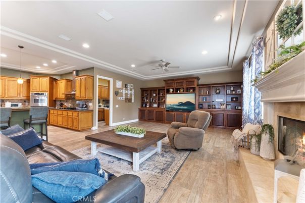 Fireplace, Interior, Kitchen, Living room, Pendant Lights, Recessed Lighting, Stainless Steel Appliances, Wood Texture Flooring