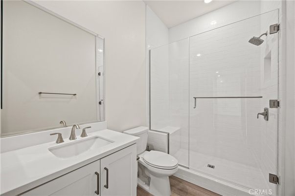 Bathroom, Glass Shower, Interior, Recessed Lighting, Wood Texture Flooring