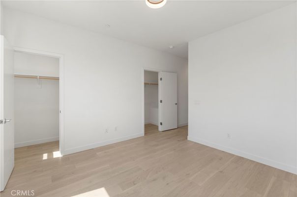 Bathroom, Dual Sink Vanities, Glass Shower, Interior, Recessed Lighting, Wood Texture Flooring