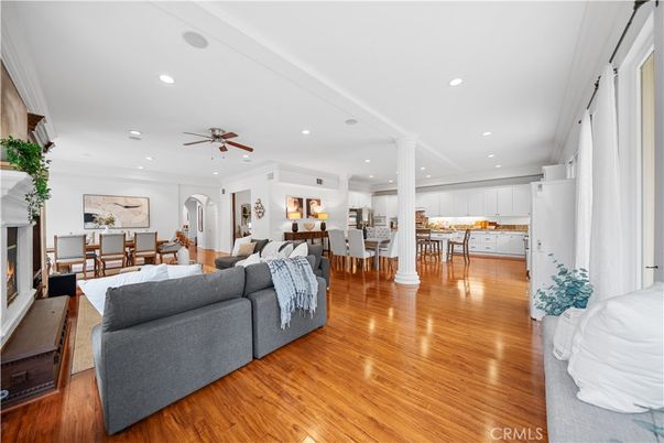 Dining room, Fireplace, Interior, Living room, Recessed Lighting, Wood Texture Flooring
