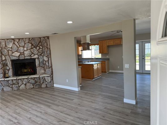 Fireplace, Interior, Kitchen, Pendant Lights, Recessed Lighting, Stone Walls, Wood Texture Flooring
