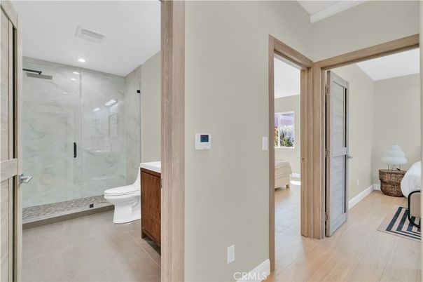 Bathroom, Glass Shower, Interior, Marble Walls, Recessed Lighting, Wood Texture Flooring