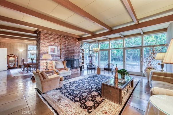 Chandelier, Dining room, Fireplace, Interior, Living room, Pendant Lights, Stone Walls, Wooden Beams