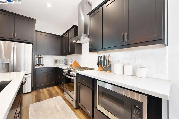 Interior, Kitchen, Recessed Lighting, Stainless Steel Appliances, Wood Texture Flooring