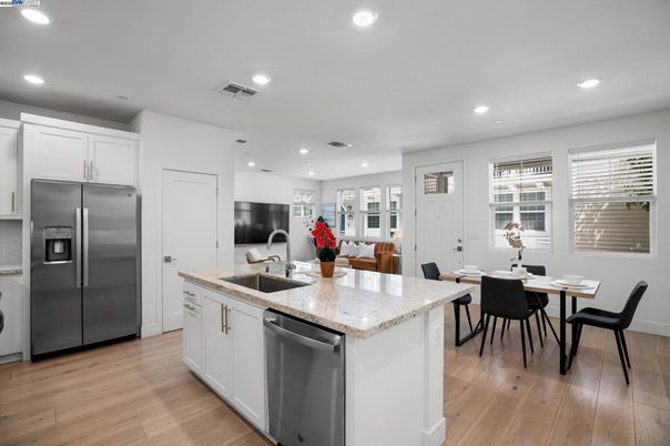 Dining room, Interior, Kitchen, Recessed Lighting, Stainless Steel Appliances, Wood Texture Flooring